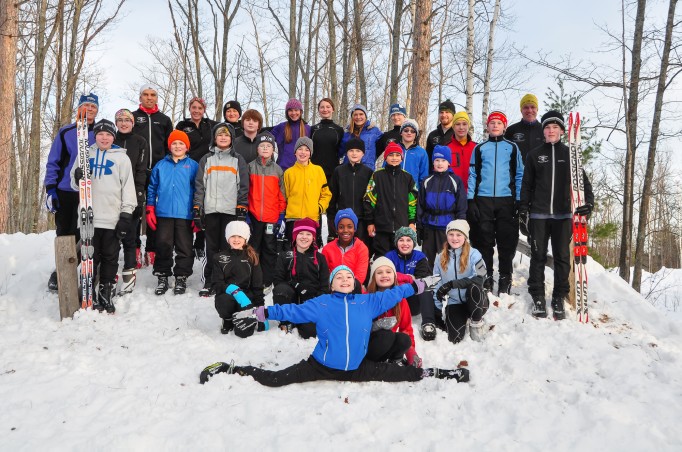 Superiorland Ski Club Middle school Team members pose on hill covered snow
